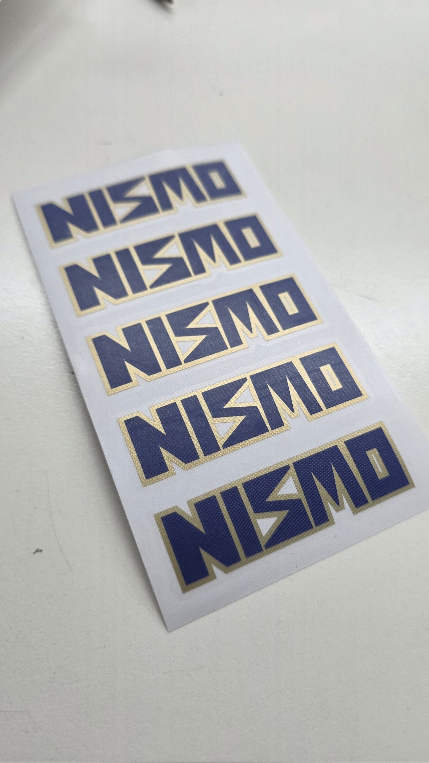 NISMO LM-GT1 Wheel Decals – Gold & Blue Layered Vinyl (Set of 5)